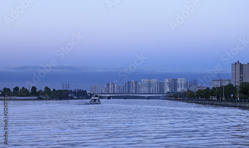 View of the new district of Moscow and the river with a floating ship. © brabus45