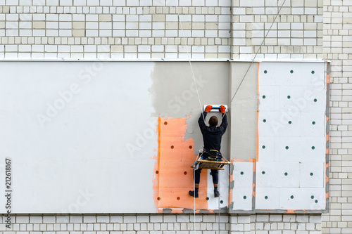 Industrial climber during winterization works.