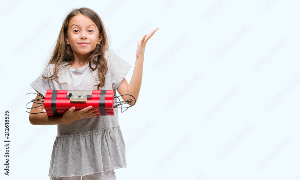 Brunette hispanic girl holding a bomb very happy and excited, winner expression celebrating victory screaming with big smile and raised hands Brunette hispanic girl holding a bomb very happy and excited, winner expression celebrating victory screaming with big smile and raised hands