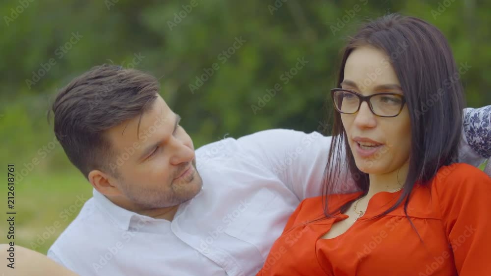 A young couple is resting on nature. Pregnant girl beautiful couple. Lovers. A young couple is resting on nature. Pregnant girl beautiful couple. Lovers.