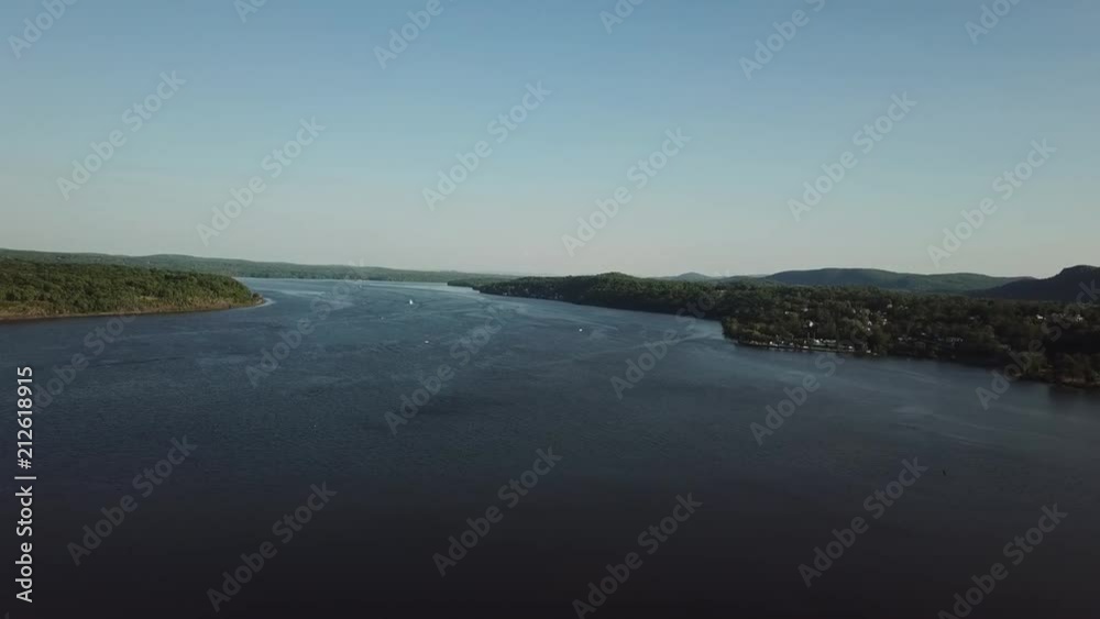 This is a beautiful drone shot of the wide Hudson River in all its glory. This is a beautiful drone shot of the wide Hudson River in all its glory.