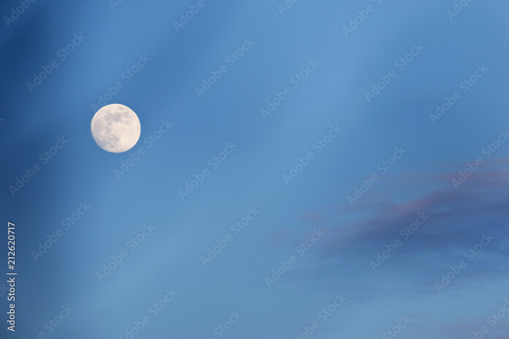 The full moon is shining brilliantly at night. The full moon is shining brilliantly at night.