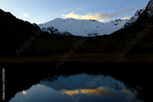 Sunset view of the Huaytapallana snow covered lagoon in the central Andes of Peru.