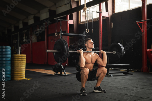 Konstfotografi Muscular man during his weightlifting workout in the gym