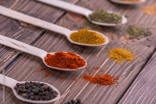 Set spices in measuring spoon. Cooking and seasoning for taste.