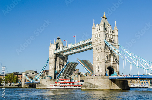 Photography Ship passing under Tower bridge