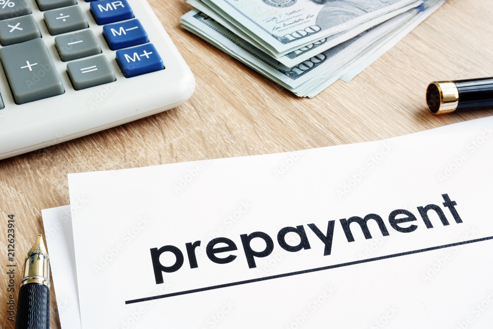 Prepayment. Document, calculator and dollars on a desk. Stock Photo | Adobe  Stock