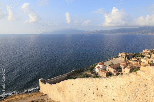 The eastern wall of the medieval castle town of Monemvasia founded in 583 overlooking the Aegean sea. Monemvasia, Peloponnese, Greece, June 2018. photo