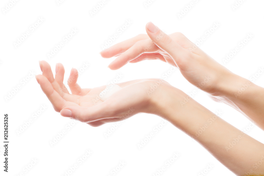 Cream on a woman's hand. Isolated against background