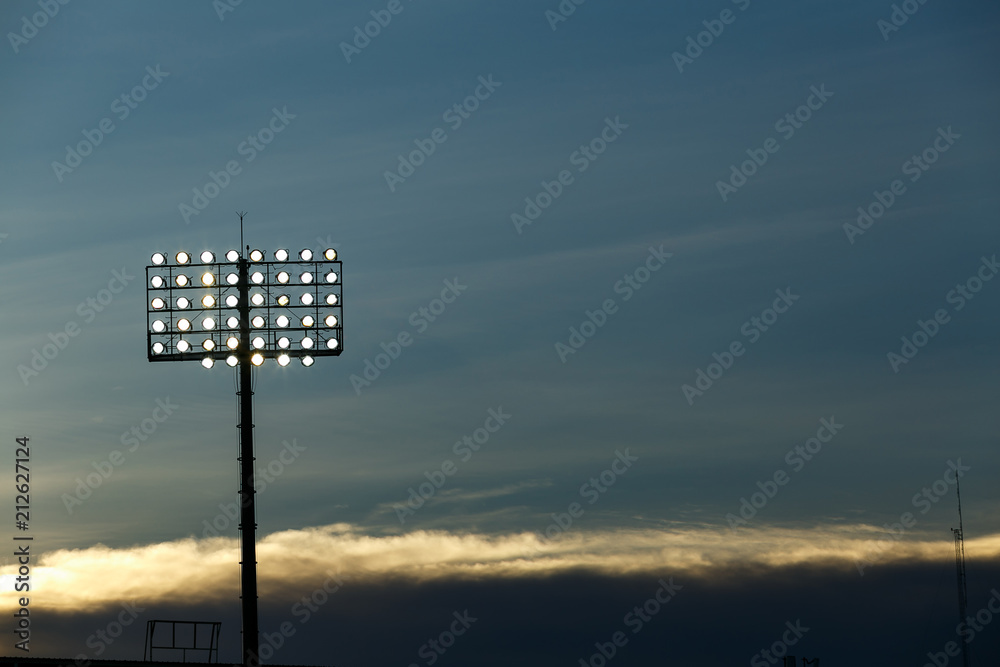 Spotlight under blue sky between soccer competition. Spotlight under blue sky between soccer competition.