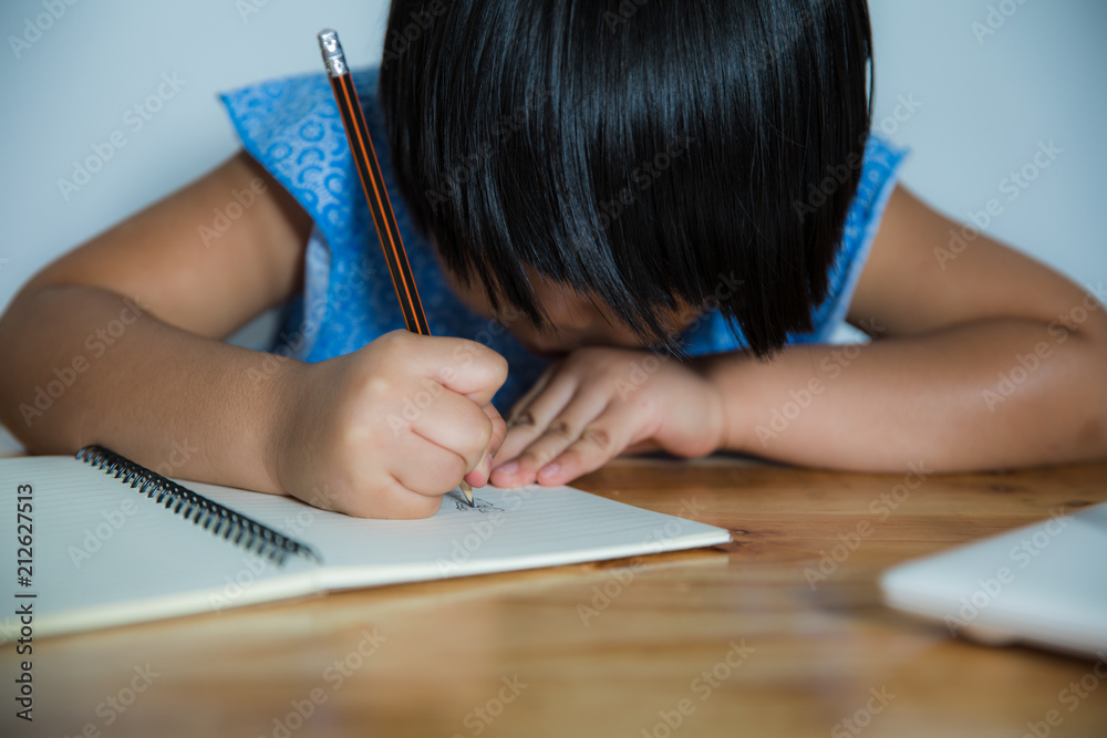 Asian Girl writes to writing books. Asian Girl writes to writing books.