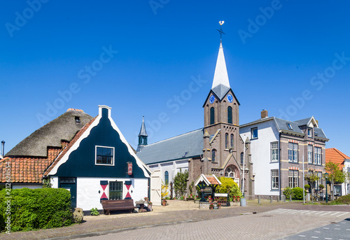 Village Oudeschild with Martinus church and trraditional gable  houses on the Wadden island Texel in the Netherlands photo