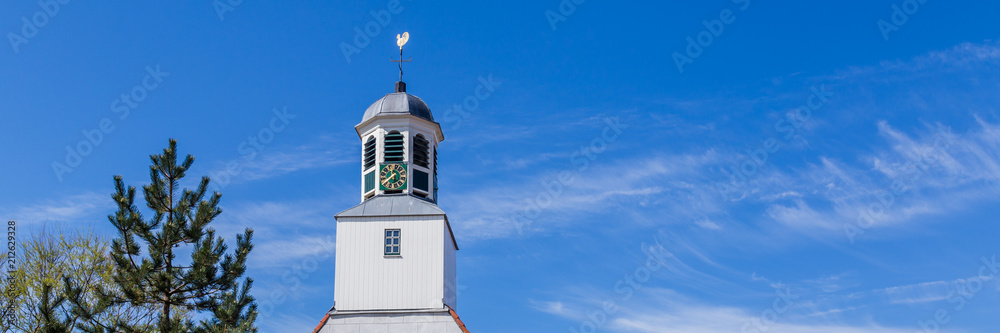 White wooden chruch tower with clock in Den Burg Texel, Netherlands White wooden chruch tower with clock in Den Burg Texel, Netherlands
