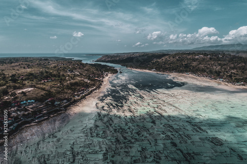 Aerial drone view of low tide on the beach of Nusa Lembongan island, Bali, Indonesia