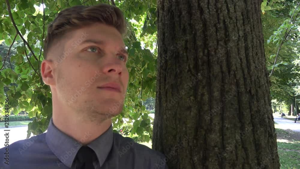 Overwhelmed stressed sad business man outdoor closeup looking around thinking 4K Overwhelmed stressed sad business man outdoor closeup looking around thinking 4K
