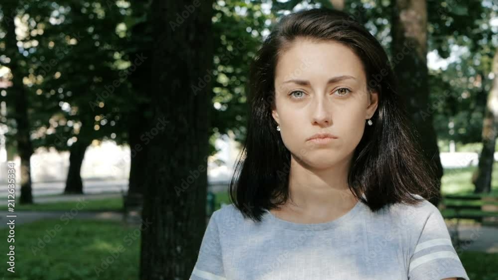 Portrait of beautiful caucasian serious woman with different eyes, heterochromia, Slow Motion Portrait of beautiful caucasian serious woman with different eyes, heterochromia, Slow Motion
