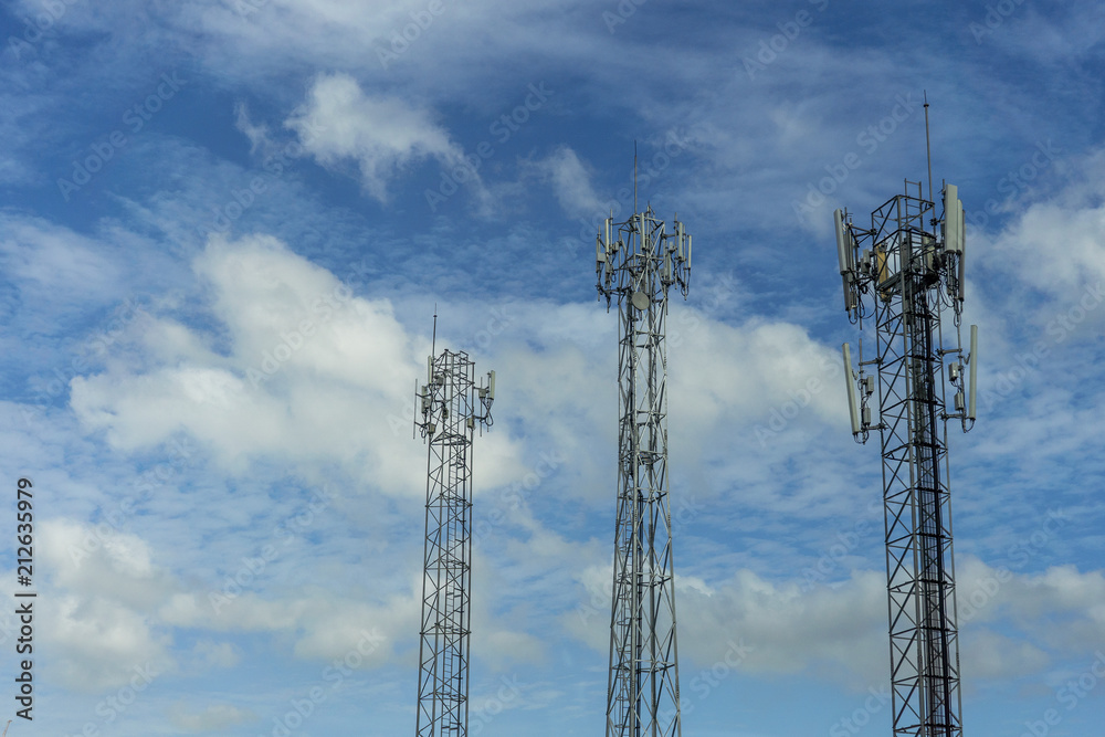 Mobile phone communication tower transmission signal with blue sky background and antenna Mobile phone communication tower transmission signal with blue sky background and antenna