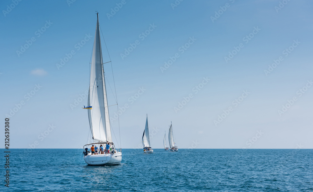 Fleet of sailing boats during race