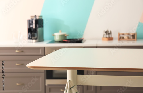 Stylish table in modern kitchen © Africa Studio