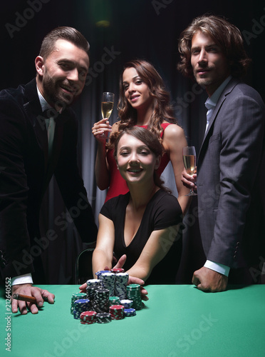 Woman doing all-in playing poker photo