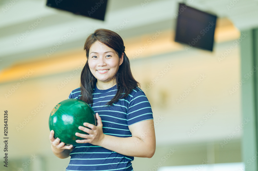 Asian woman having fun at bowling Asian woman having fun at bowling