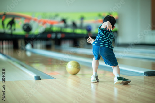 Asian boy having fun at bowling