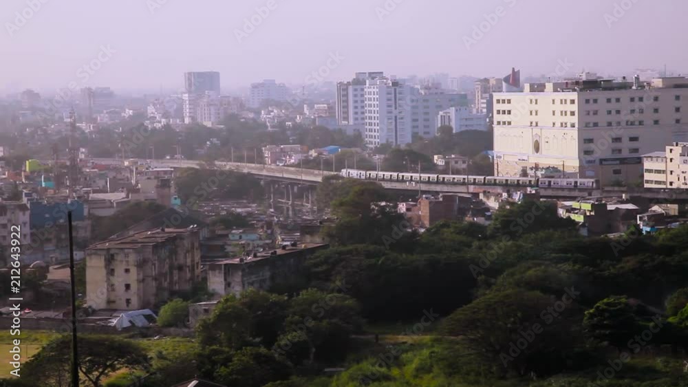 Aerial view of train over a busy metro city in India Aerial view of train over a busy metro city in India