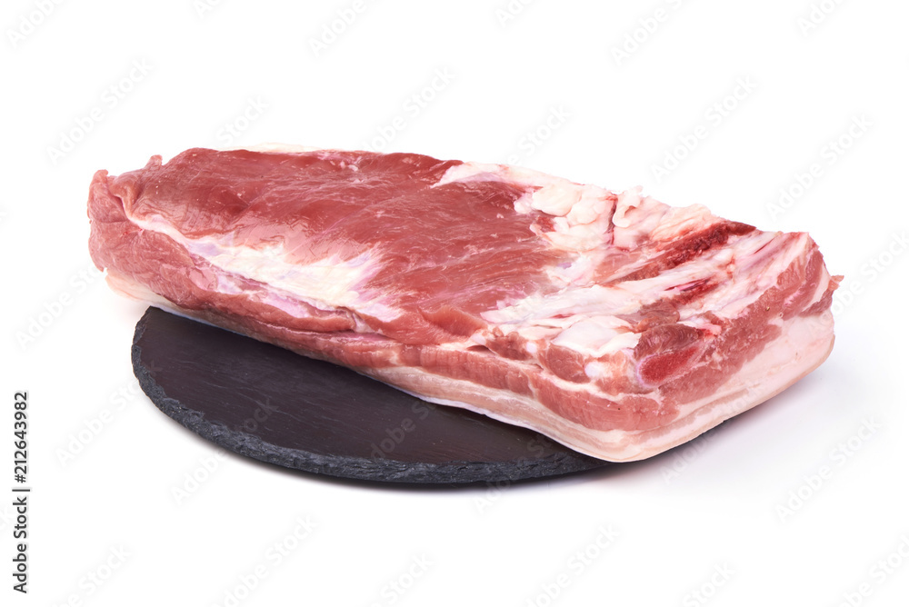Raw pork meat, served on the slate plate, isolated on white background. Raw pork meat, served on the slate plate, isolated on white background.