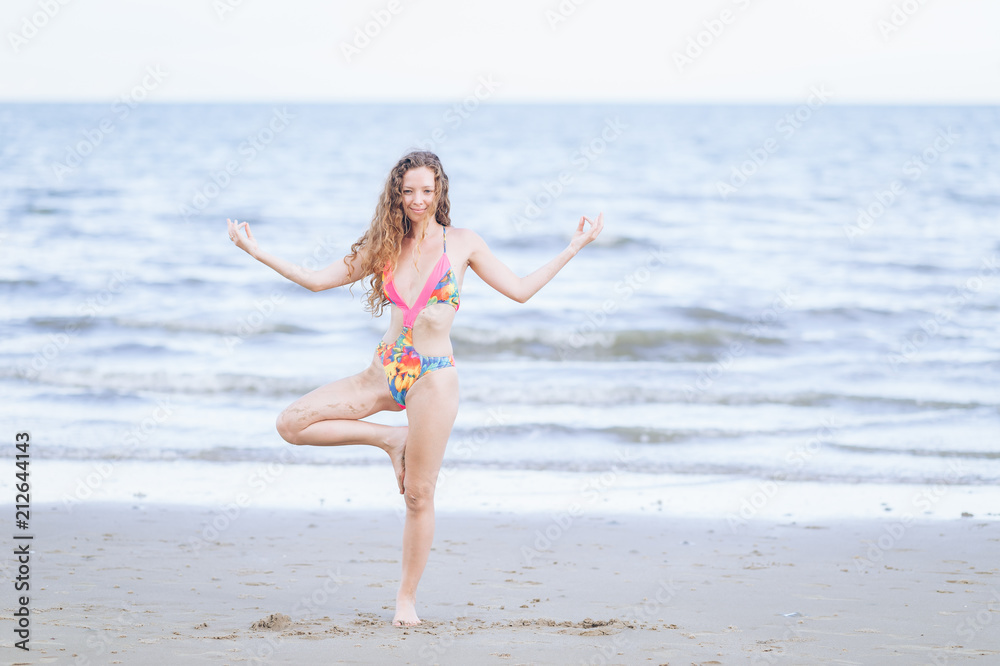 Yoga meditation on beach,Bikini body woman meditating relaxing on seaside Yoga meditation on beach,Bikini body woman meditating relaxing on seaside