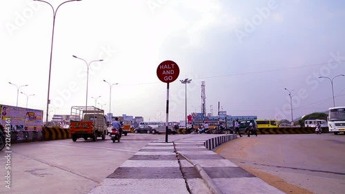 Motorbikes and Bus Passing Over Bridge. Busy rush hour street scene.