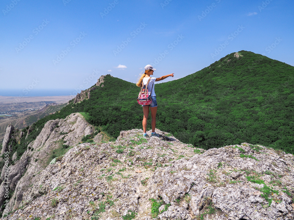 Young girl at the top of the mountain