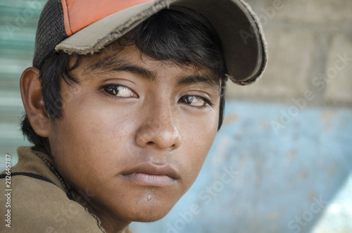 Latin American teen Great glance portrait from a young boy in the southern border of Mexico photo