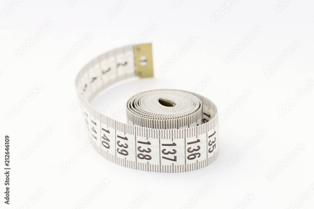 Tape for measuring isolated on white background. Used for sewing and during diet. Tape for measuring isolated on white background. Used for sewing and during diet.