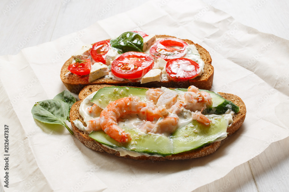 healthy open sandwich with tomatoes, shrimps and ricotta cheese