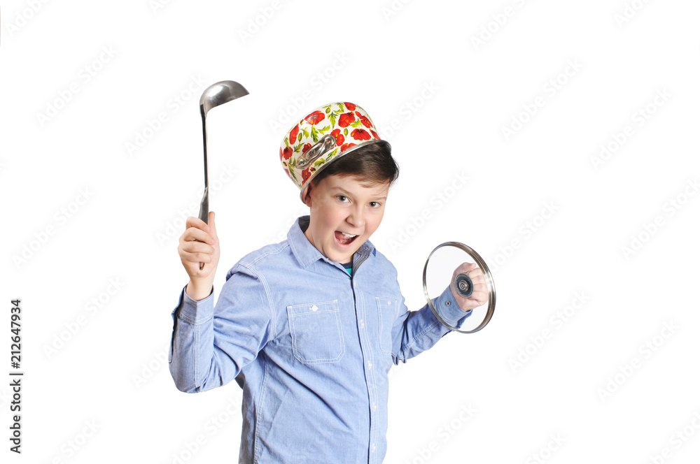 Fototapeta premium Boy with a pot on a head holding steel soup ladle and pot lid isolated on white background
