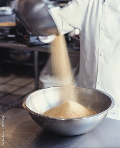 Flour flow into bowl Measuring baking flour with expertise
