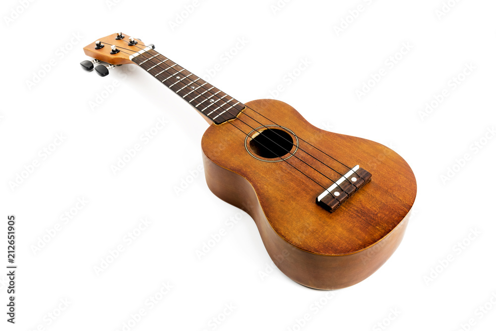 Fototapeta premium The brown ukulele on the white background,