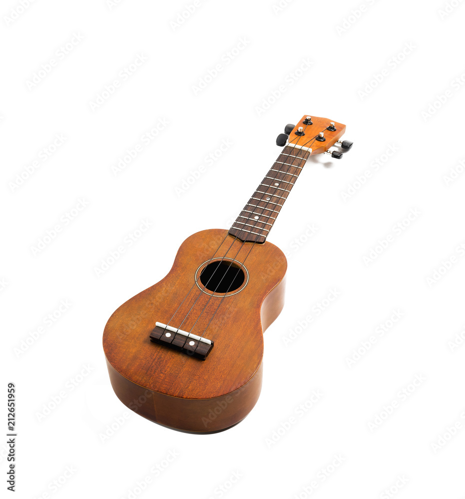 Fototapeta premium The brown ukulele on the white background, with Clipping path