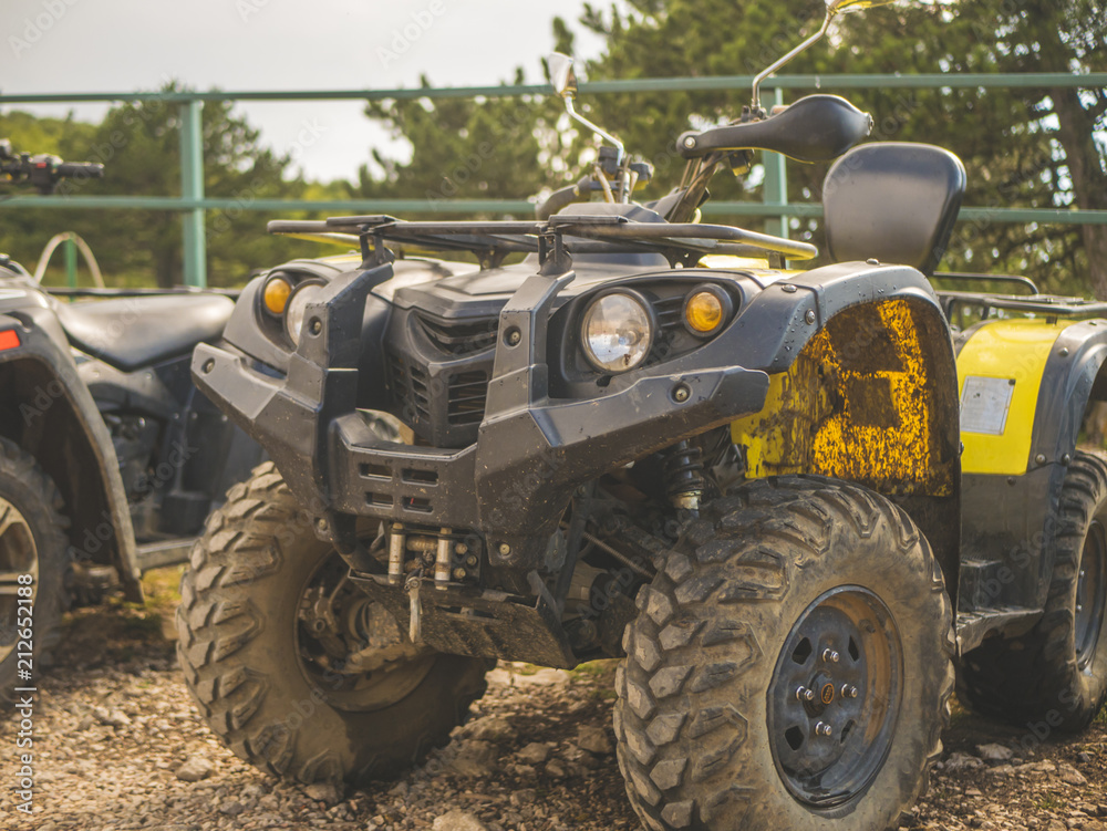 close up shot of atv 4x4 dirty motor bike outdoors close up shot of atv 4x4 dirty motor bike outdoors