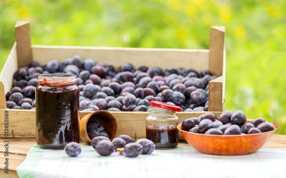 Organic plum fruit products, jar of jam. Plum jam. Organic plum fruit products, jar of jam. Plum jam.