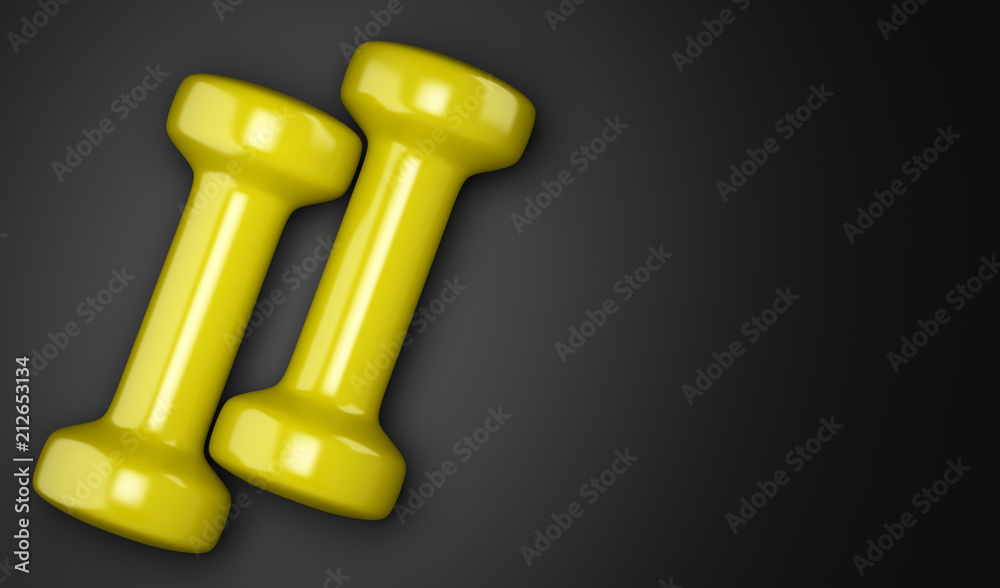 yellow dumbbells isolated on black background yellow dumbbells isolated on black background
