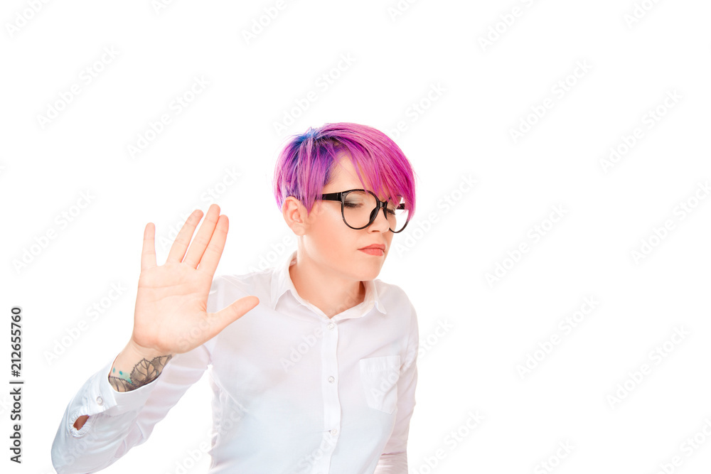 Offended young woman showing stop gesture