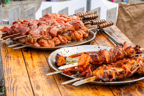 cooked meat on an open fire stacked on a metal dish