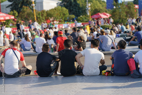 The football fans in Moscow downtown. They have fun and support their country in the competition