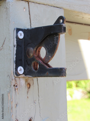 An old rusted gate latch