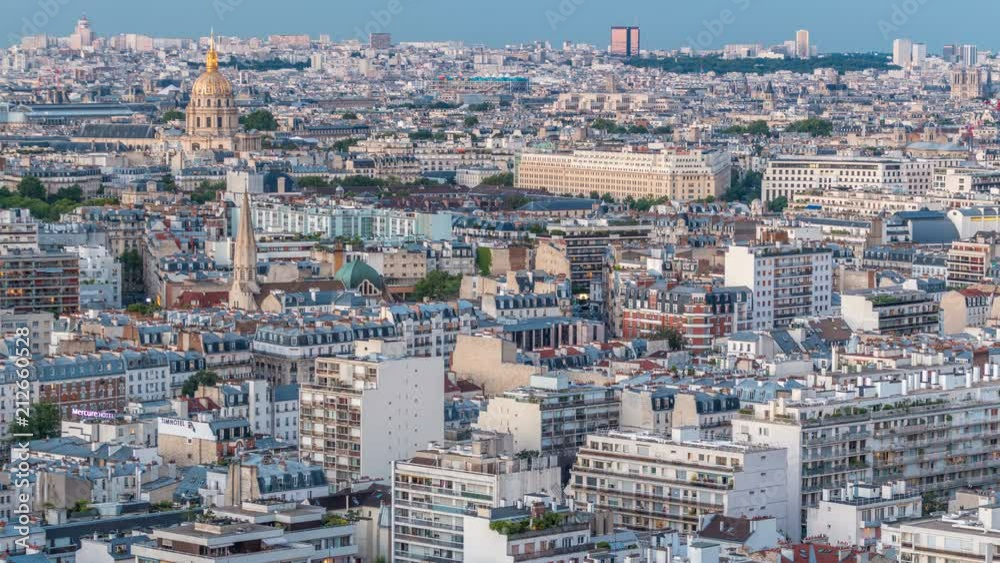 Aerial panorama above houses rooftops in a Paris day to night timelapse Aerial panorama above houses rooftops in a Paris day to night timelapse