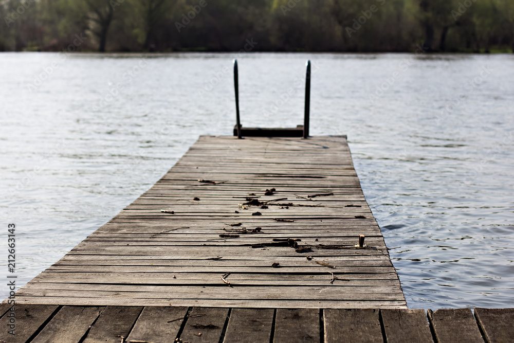 Fototapeta premium Wooden bridge, pier near the river