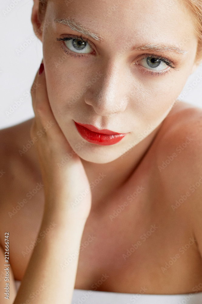 Beautiful girl of European appearance. Red hair with a touch of honey.Beauty shooting. Large-face portrait Beautiful girl of European appearance. Red hair with a touch of honey.Beauty shooting. Large-face portrait