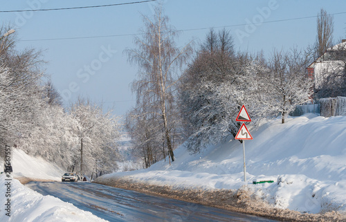 The main road between the Village of Edge and Holcombe on a blue sky Winter day, The Cotswolds, Gloucestershire, UK photo