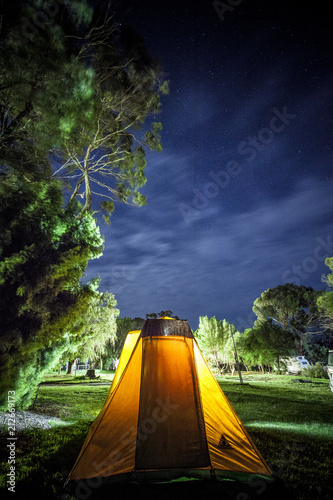 Tent in caravan park at night